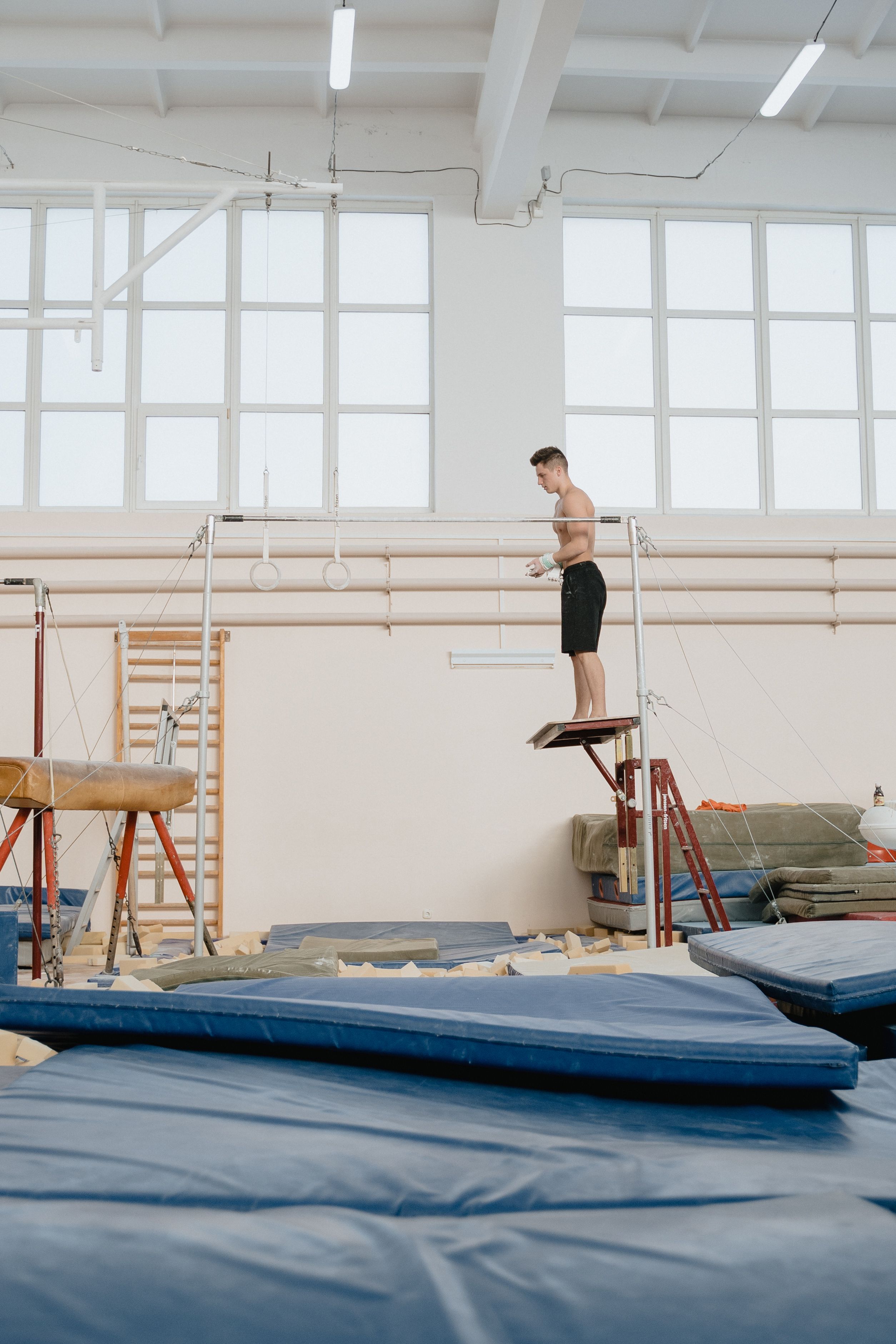 Teen gymnast performing advanced moves